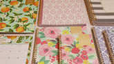 day designer for blue sky collection featuring geometric and floral front covers and the same trusted interior format with do to do lists, and ample writing space.