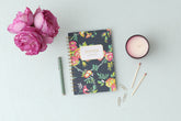 5.75x8.5 floral designed notebook featuring ample writing space for notes, a gold twin wire-o binding, and a smart way to start planning