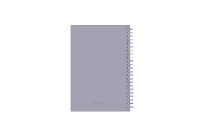 January 2024 to December 2024 weekly planner featuring a solid flexible light purple back cover, silver twin wire-o, and a compact 5x8 size planner