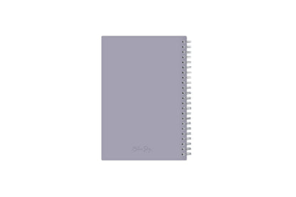January 2024 to December 2024 weekly planner featuring a solid flexible light purple back cover, silver twin wire-o, and a compact 5x8 size planner