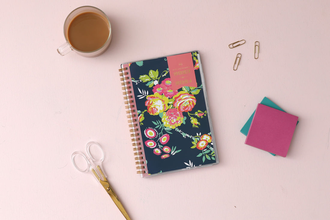 2023-2024 weekly monthly academic planner from Day Designer for Blue Sky featuring a navy background and floral front cover 5x8