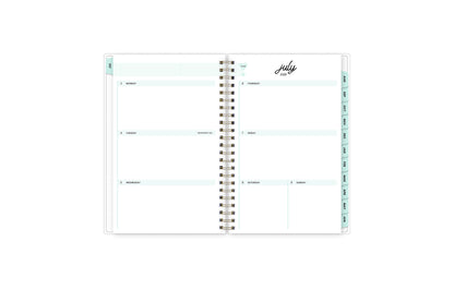weekly spread featuring july 2023 with clean writing space for each day, mint monthly tabs