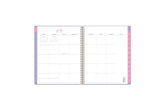 July 2023 - June 2024 dated monthly planner spread featuring blank writing space for each day, goals section, and pink monthly tabs
