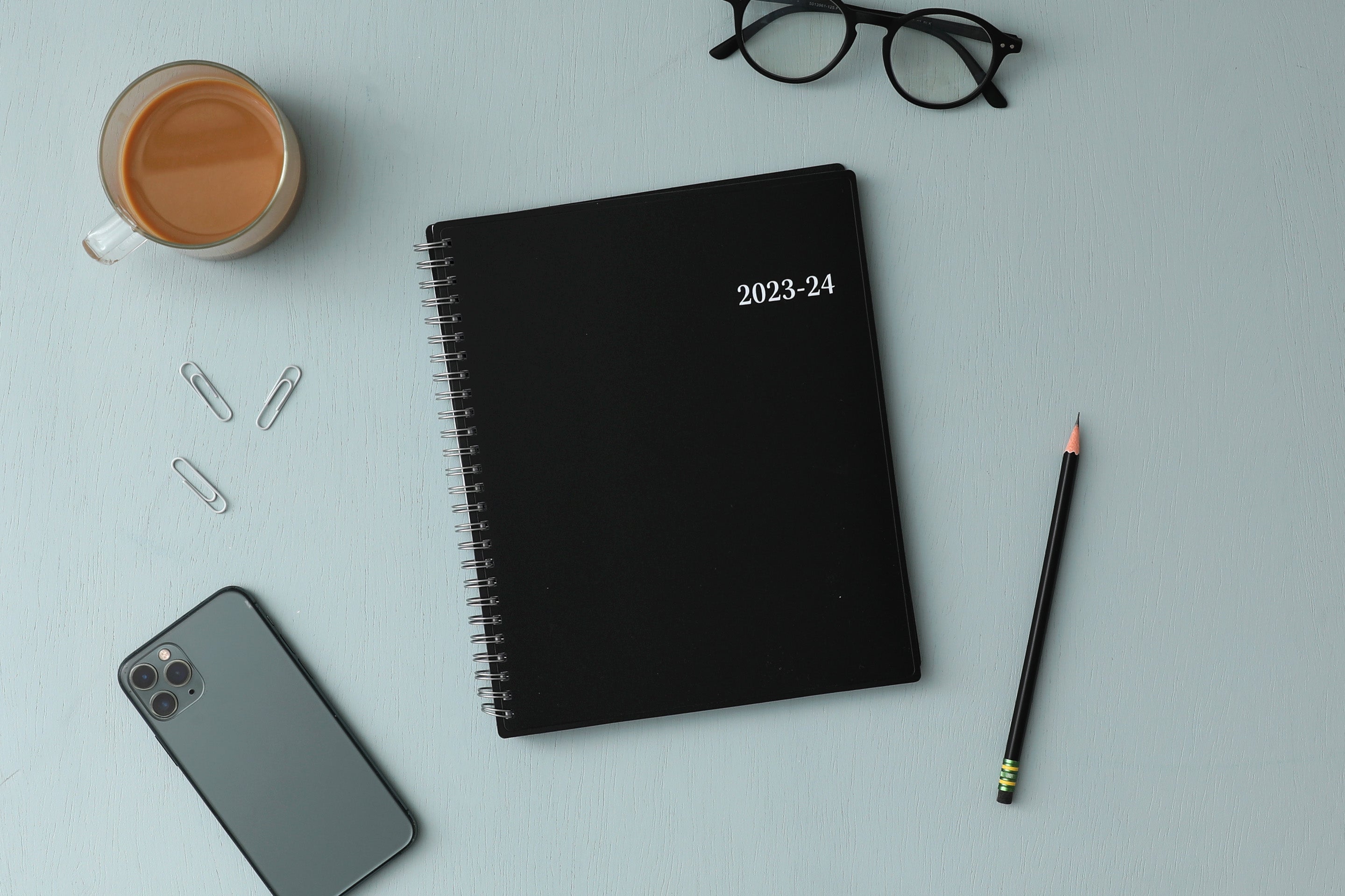 July 2023 - June 2024 weekly monthly academic planner featuring a solid black cover and silver twin wire-o binding 7x9 size