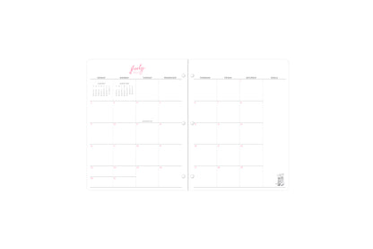 Monthly spread featuring blank writing space, goals section